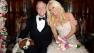 Hugh Hefner and Crystal Harris pose with their Cavalier King Charles Spaniel Charlie for an official wedding photo. The two tied the knot at the Playboy Mansion on Dec. 31, 2012 -- New Year's Eve.
