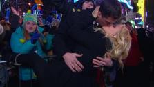 Jenny McCarthy kisses U.S. Navy member Benjamin Moore on Dick Clarks New Years Rockin Eve on Dec. 31, 2012. - Provided courtesy of Dick Clark Productions / ABC