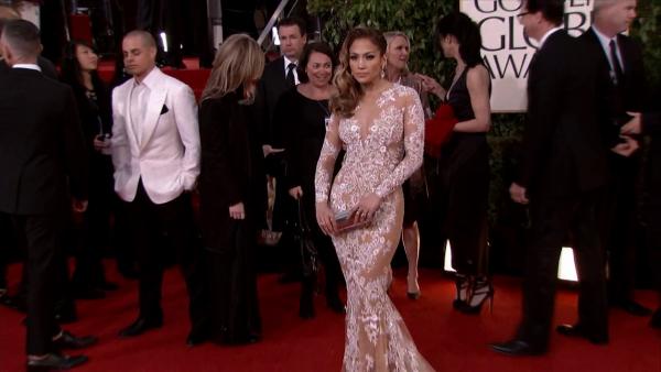 Jennifer Lopez appears at the 2013 Golden Globe Awards in Beverly Hills, California on Jan. 13, 2013. Her boyfriend, Casper Smart, is picture on the left.