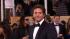 Bradley Cooper poses on the red carpet at the...
