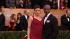 Taye Diggs and Idina Menzel pose on the red...