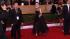 Anne Hathaway poses on the red carpet at the...