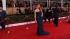 Jennifer Lawrence poses on the red carpet at the...