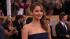 Jennifer Lawrence poses on the red carpet at the...