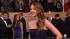 Jennifer Lawrence poses on the red carpet at the...