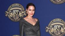 Angelina Jolie wears a gray Atelier Versace dress to the American Society of Cinematographers 27th Annual Outstanding Achievement Awards on Feb. 10, 2013. - Provided courtesy of Versace