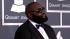 Rick Ross walks the 2013 Grammy Awards red...