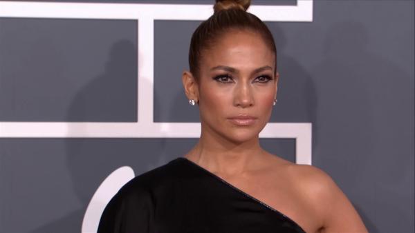 Jennifer Lopez and Casper Smart walk the red carpet at the 2013 Grammys on Feb. 10, 2013.