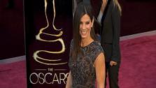 Sandra Bullock walks the red carpet at the 2013 Oscars on Sunday, February 24.