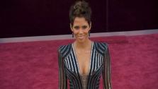 Halle Berry walks the red carpet at the 2013 Oscars on Sunday, February 24.