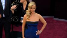 Reese Witherspoon walks the red carpet at the 2013 Oscars on Sunday, February 24.