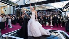 Jennifer Lawrence is interviewed by Kristin Chenoweth upon her arrival for The Oscars at the Dolby Theatre in Hollywood on Feb. 24, 2013.