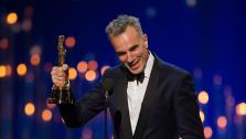 Daniel Day-Lewis accepts his award for Best Actor in a Leading Role at the Oscars on February 24, 2013.