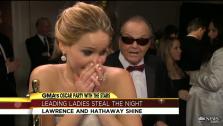 Jennifer Lawrence appears in an interview with George Stephanopoulos at the Oscars on February 24, 2013. Jack Nicholson can be seen peeking from behind the award winning actress.