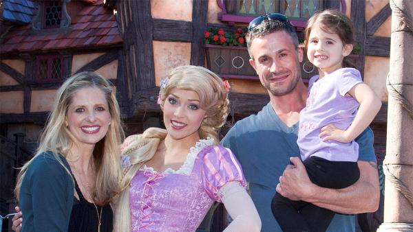 Sarah Michelle Gellar, Freddie Prinze Jr. and their daughter Charlotte, 3, meet Rapunzel at the all-new 'Fantasy Faire' attraction at Disneyland park in Anaheim, California on Wednesday, March 6, 2013.