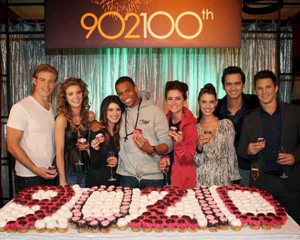 Pictured L-R: Trevor Donovan, AnnaLynne McCord, Shenae Grimes, Tristan Wilds, Jessica Stroup, Jessica Lowndes, Michael Steger and Matt Lanter celebrate the 100th episode of 90210 with cupcakes on Nov. 30, 2012. - Provided courtesy of Scott Alan Humbert / The CW Network Pictured L-R: Trevor Donovan, AnnaLynne McCord, Shenae Grimes, Tristan Wilds, Jessica Stroup, Jessica Lowndes, Michael Steger and Matt Lanter celebrate the 100th episode of 90210 with cupcakes on Nov. 30, 2012. - Provided courtesy of Scott Alan Humbert / The CW Network
