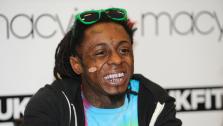 Lil Wayne appears at his hometown Macys, in the Lakeside area of New Orleans, to meet fans and promote his contemporary streetwear brand TRUKFIT, on Friday, Feb. 1, 2013 in Lakeside, Louisiana. - Provided courtesy of Jack Dempsey / Invision / AP