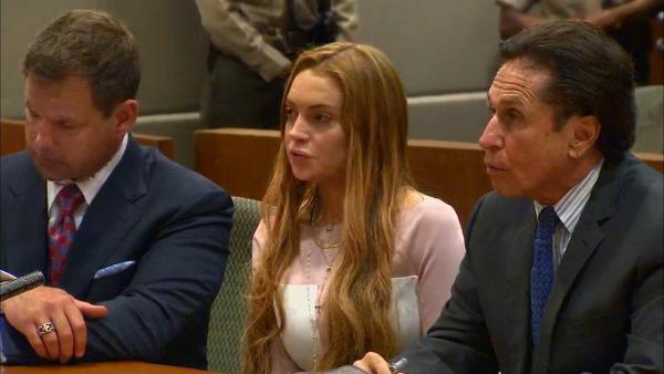 Lindsay Lohan appears at a Los Angeles court on March 18, 2013 at a trial over a 2012 car crash case.