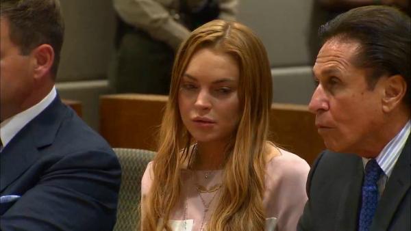 Lindsay Lohan appears at a Los Angeles court on March 18, 2013 at a trial over a 2012 car crash case.
