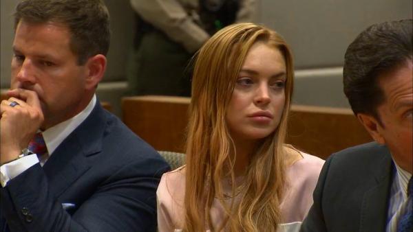 Lindsay Lohan appears at a Los Angeles court on March 18, 2013 at a trial over a 2012 car crash case.