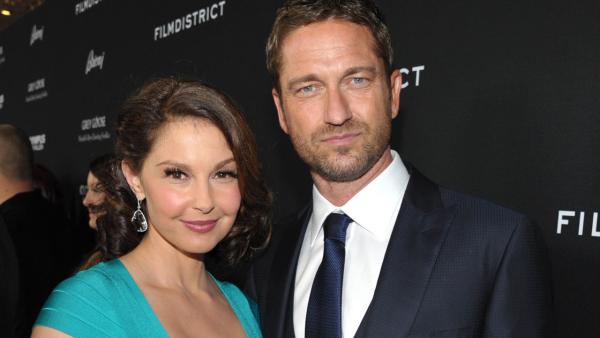 Ashley Judd and Gerard Butler pose at the LA premiere of Olympus Has Fallen at the ArcLight Theatre on Monday, March 18, 2013 in Los Angeles. - Provided courtesy of AP / Jordan Strauss