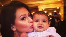 JWoww kisses Snookis son, Lorenzo, after his baptism on Sunday, March 24, 2013. - Provided courtesy of twitter.com/JENNIWOWW/status/315971708467154945 / instagram.com/p/XQlKJEqS4_/)