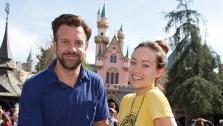Newly-engaged couple Olivia Wilde and Jason Sudeikis try their luck at removing the Sword in the Stone at Disneyland park in Anaheim, California on Tuesday, March 26, 2013. This was Wildes first visit to a Disney theme park. - Provided courtesy of Paul Hiffmeyer / Disneyland