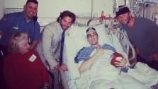 Jeff Bauman Jr., who lost his legs below the knees in the April 15, 2013 Boston Marathon bombing, receives a hospital visit from Bradley Cooper and New England Patriots player Julian Edelman on April 18, 2013. - Provided courtesy of twitter.com/Edelman11/status/325083563810762753/photo/1 / pic.twitter.com/bdHCu3zm1W