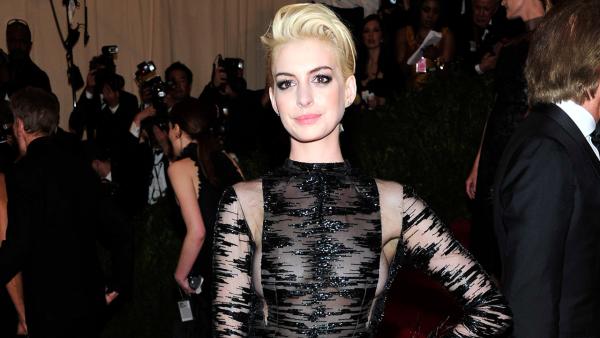 Anne Hathaway attends The Metropolitan Museum of Arts Costume Institute benefit celebrating PUNK: Chaos to Couture on Monday May 6, 2013 in New York. - Provided courtesy of Charles Sykes/Invision/AP