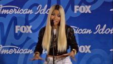 Nicki Minaj talks to reporters backstage after the American Idol season 12 finale on May 16, 2013. Candice Glover beat Kree Harrison for the title. - Provided courtesy of FOX
