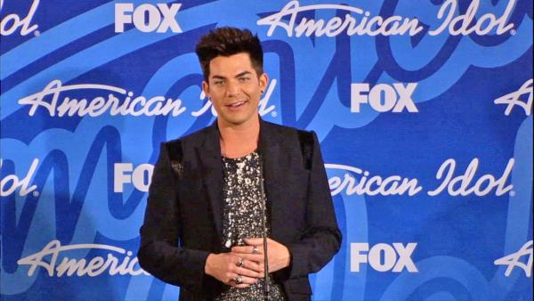 Former finalist and glam rocker Adam Lambert talks to reporters backstage after the American Idol season 12 finale on May 16, 2013. Candice Glover beat Kree Harrison to win the title. - Provided courtesy of FOX