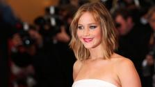 Actress Jennifer Lawrence poses for photographers as she arrives on the red carpet for the screening of the film Jimmy P. Psychotherapy of a Plains Indian at the 66th international film festival, in Cannes, southern France, Saturday, May 18, 2013. - Provided courtesy of Joel Ryan/Invision/AP