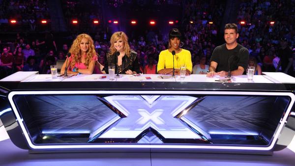 L-R: Paulina Rubio, Demi Lovato, Kelly Rowland and Simon Cowell sit at the judges table for season 3 of the FOX series The X Factor. - Provided courtesy of Ray Mickshaw / FOX L-R: Paulina Rubio, Demi Lovato, Kelly Rowland and Simon Cowell sit at the judges table for season 3 of the FOX series The X Factor. - Provided courtesy of Ray Mickshaw / FOX