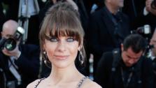 Actress Milla Jovovich arrives for the screening of Behind the Candelabra at the 66th international film festival, in Cannes, southern France, Tuesday, May 21, 2013. - Provided courtesy of AP Photo/Lionel Cironneau
