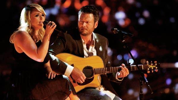 Miranda Lambert and Blake Shelton perform Over You on The Voice on May 21, 2013. - Provided courtesy of Trae Patton / NBC