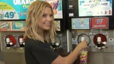 Actress Ashley Benson, of ABC Familys hit TV show Pretty Little Liars, sips a Slurpee at a 7-Eleven to promote and celebrate 7-Elevens #Awesummer Summer Slurpee Days on May 22, 2013 in Los Angeles, California. - Provided courtesy of AP / Jonathan Leibson / Getty Images for 7-Eleven