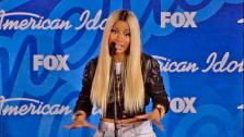 Nicki Minaj talks to reporters backstage after the American Idol season 12 finale on May 16, 2013. Candice Glover beat Kree Harrison for the title. - Provided courtesy of FOX
