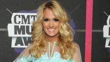Carrie Underwood arrives at the 2013 CMT Music Awards in Nashville, Tenn. on Wednesday, June 5, 2013. - Provided courtesy of AP / AP Photo/Charles Sykes