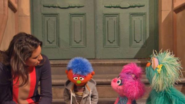 Alex, a Muppet whose parent is in jail, and several Sesame Street cast members appear in a video for Sesame Workshops Little Children, Big Challenges: Incarceration initiative. - Provided courtesy of 2013. Sesame Workshop. All rights reserved.