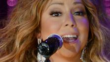 Mariah Carey, wearing a fancy sling, performs with the New York Philharmonic at the 2013 MLB All-Star Charity Concert, benefiting Hurricane Sandy relief efforts, in New York Citys Central Park on July 13, 2013. - Provided courtesy of Humberto Carreno / startraksphoto.com