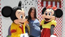 A pregnant Jennifer Love Hewitt poses with Mickey and Minnie Mouse at Old Navys Mickey Through The Decades Collection Launch at the Walt Disney Company studio lot in Burbank, California. - Provided courtesy of Michael Simon / startraksphoto.com