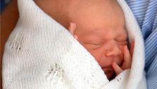 Prince George appears while being held by his father, Prince William, at St Marys Hospital in London, England, on July 23, 2013. - Provided courtesy of Barcroft Media/startraksphoto.com