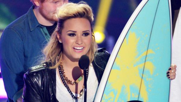 Demi Lovato accepts the choice female TV personaity: female award at the Teen Choice Awards at the Gibson Amphitheater on Sunday, Aug. 11, 2013, in Los Angeles. - Provided courtesy of John Shearer/Invision/AP Demi Lovato accepts the choice female TV personaity: female award at the Teen Choice Awards at the Gibson Amphitheater on Sunday, Aug. 11, 2013, in Los Angeles. - Provided courtesy of John Shearer/Invision/AP
