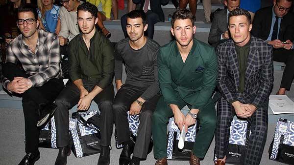 Zachary Quinto, Jonas Brothers members Kevin, Joe and Nick Jonas and Teen Wolf actor Colton Haynes sit together at Richard Chais fashion show at Lincoln Center in New York, part of the Spring 2014 Mercedes-Benz Fashion Week, on Sept. 5, 2013. - Provided courtesy of Amanda Schwab / Startraksphoto.com