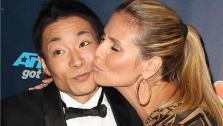 Americas Got Talent co-judge Heidi Klum kisses season 8 winner and dancer Kenichi Ebina on the red carpet after the finale at Radio City Music Hall in New York on Sept. 18, 2013. - Provided courtesy of Amanda Schwab / Startraksphoto.com