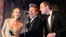 Britains Prince William, the Duke of Cambridge, right, sings with Taylor Swift, left, and Jon Bon Jovi sing Bon Jovis 1986 hit Livin On A Prayer at the Centrepoint Gala Dinner at Kensington Palace in London on Tuesday Nov. 26, 2013. - Provided courtesy of AP / Dominic Lipinski, Pool