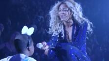 Beyonce sings to terminally-ill cancer patient Taylon at her concert in Las Vegas on Dec. 6, 2013. She later danced with the girl, fulfilling her dying wish. This image is seen in a video of the event, posted on Beyonces YouTube page on Christmas Eve. - Provided courtesy of youtube.com/user/beyonce