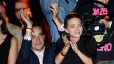 Mary-Kate Olsen and boyfriend Olivier Sarkozy watch Ronnie Wood of the Rolling Stones perform with guitarist Mick Taylor, drummer Simon Kirke and keyboardist Al Cooper at The Cutting Room in New York on Thursday, Nov. 7, 2013. - Provided courtesy of OTRC / Evan Agostini / Invision / AP