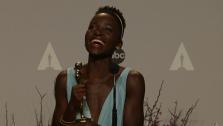 Lupita Nyongo talks backstage after winning Best Supporting Actress at the 2014 Oscars on March 2, 2014.