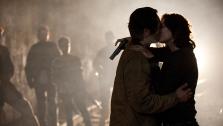 Steve Yeun (Glenn) and Lauren Cohan (Maggie) kiss in a scene from The Walking Dead season 4, episode 15, Us, which aired on March 23, 2014. - Provided courtesy of Gene page / AMC